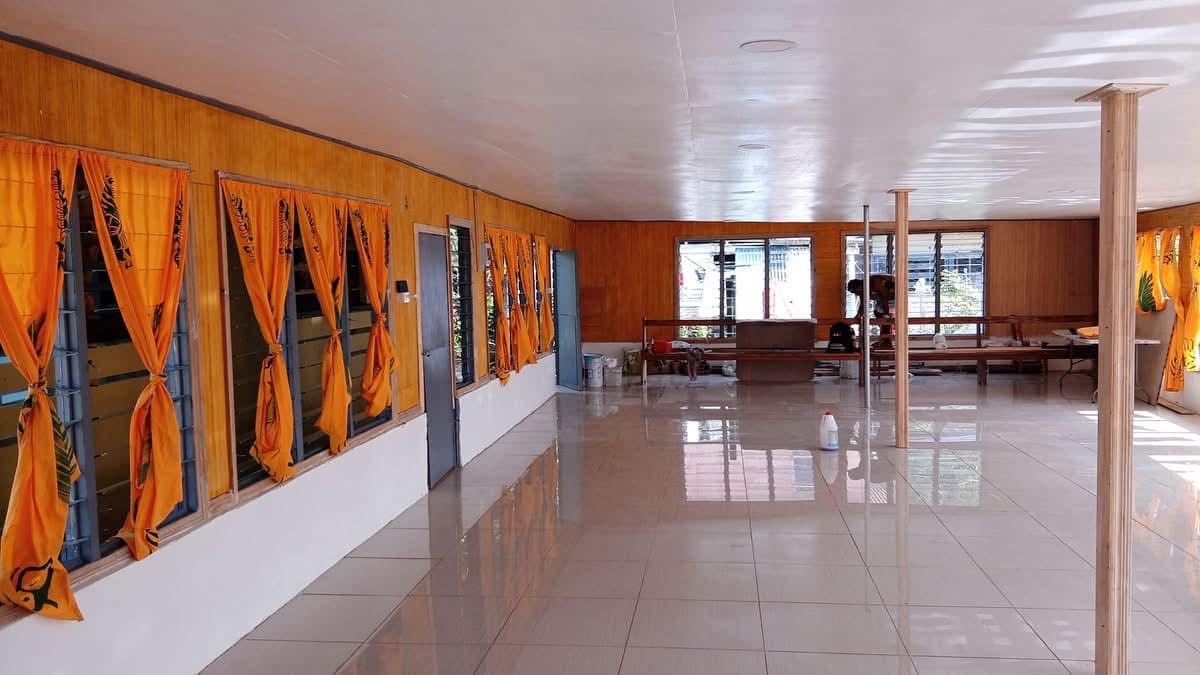 Hall Interior - Wide view with columns and shiny tiled floors